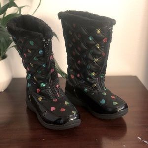 Black with colorful hearts. Inside of boot is also black and soft. Very light.